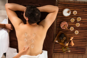 High,Angle,View,Of,A,Relaxed,Young,Man,Receiving,Cupping